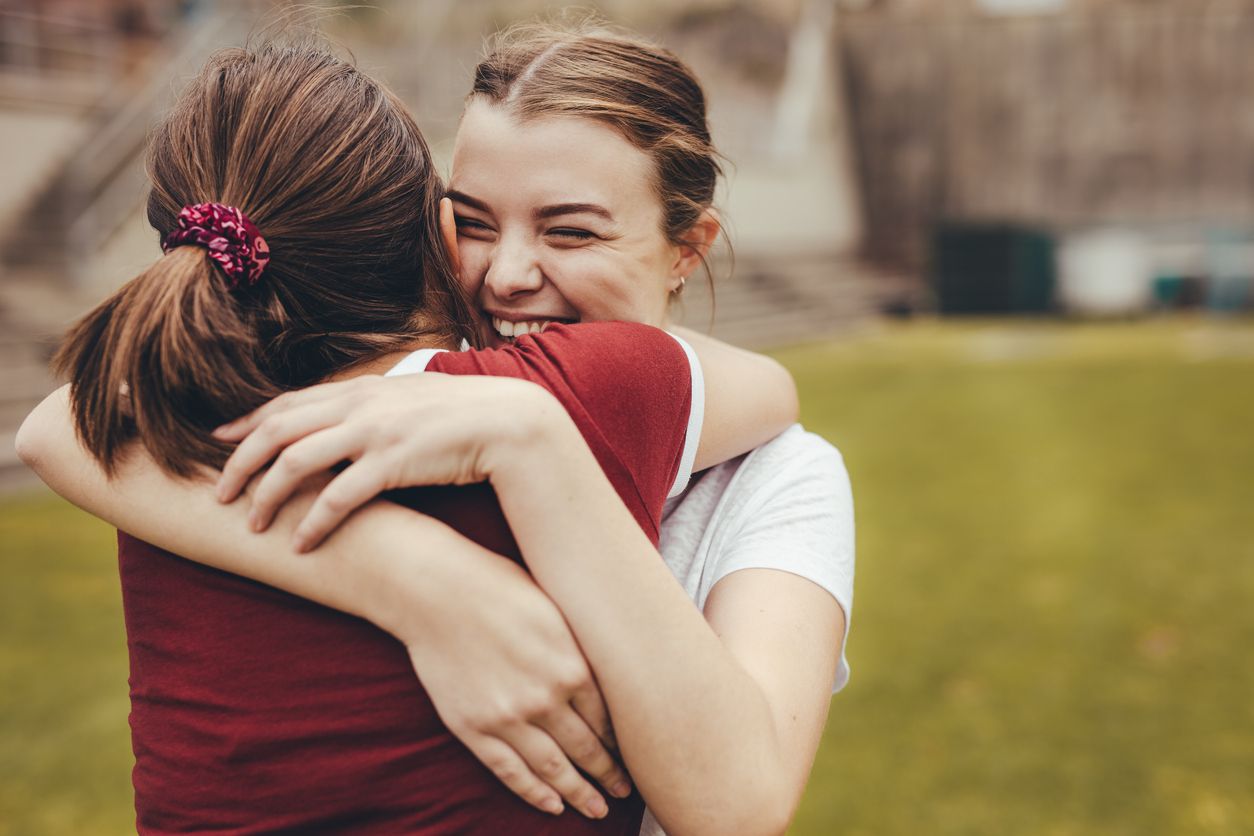 Girls hugging each other