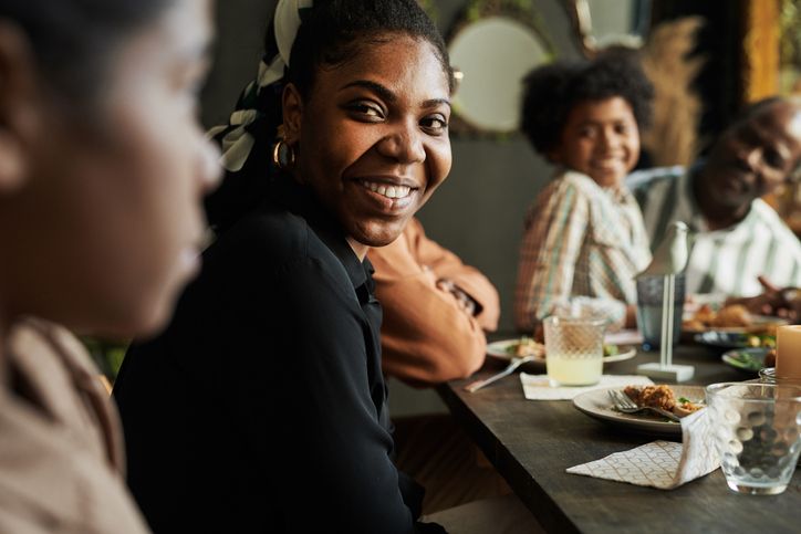 Woman enjoying a dinner with friends.